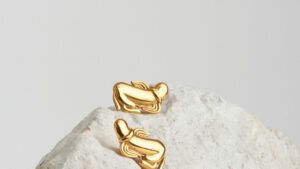 winged phallus earrings gold
