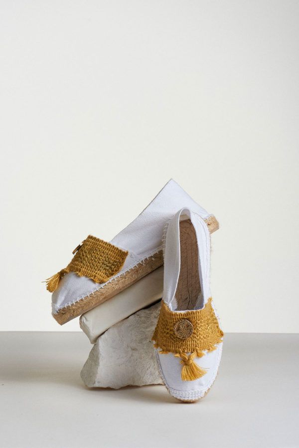 white espadrilles with ochre tassels and coin