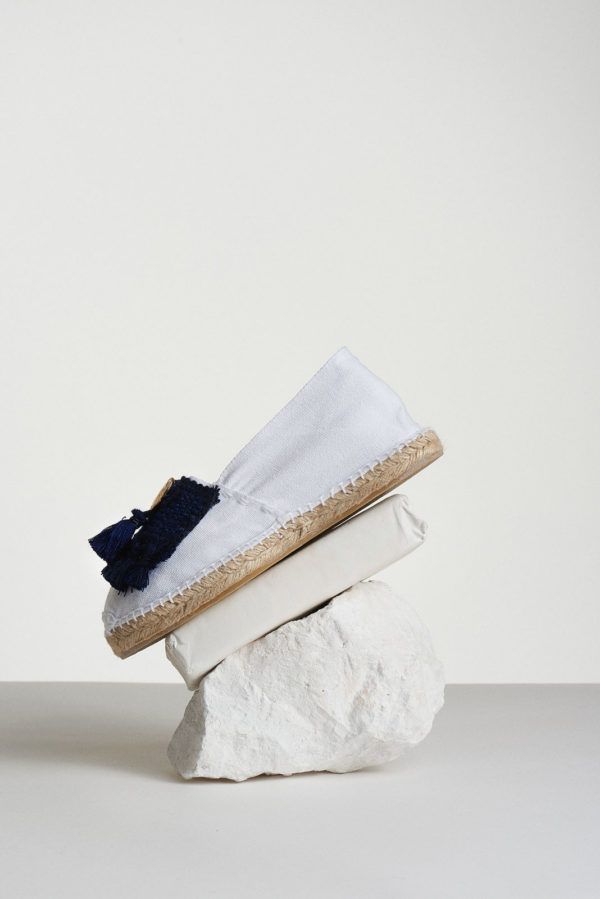 white espadrilles with blue tassels and coin side