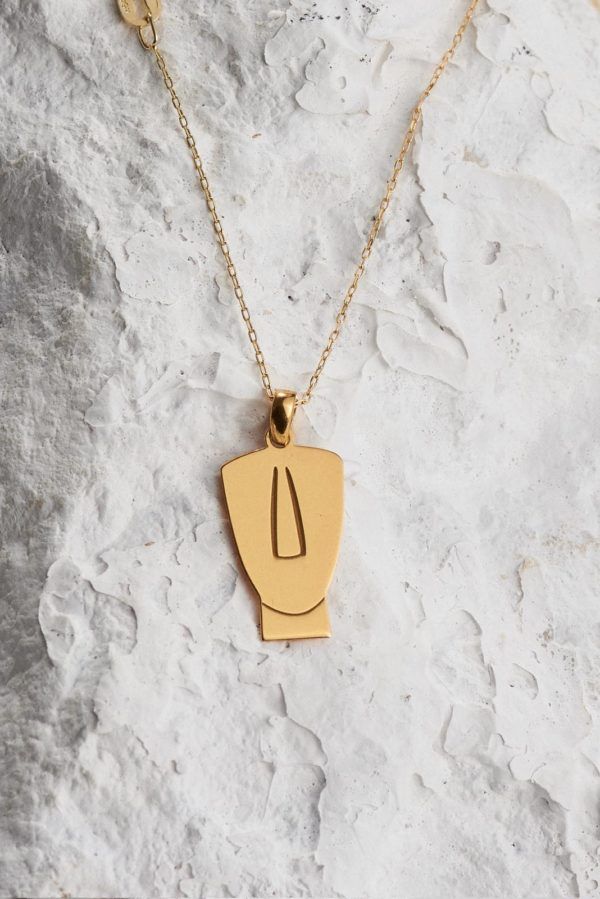 Gold plated Cycladic idol necklace close up
