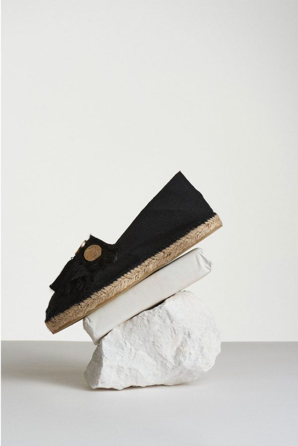 Black espadrilles with black tassels and four coins