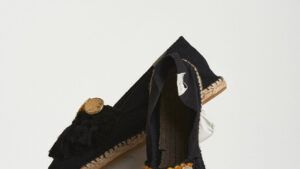Black espadrilles with black-yellow tassels and metal coins