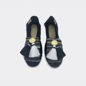Black espadrilles with wooven fabric tassels and metal coins