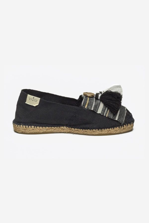 Black espadrilles with wooven fabric tassels and metal coins