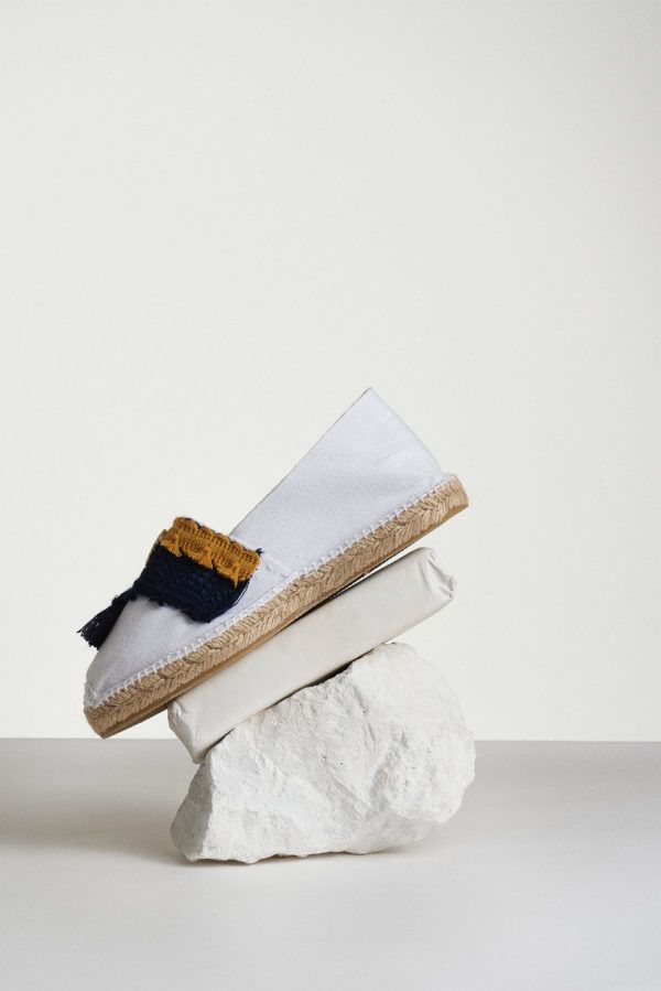 White espadrilles with blue-yellow tassels and coins